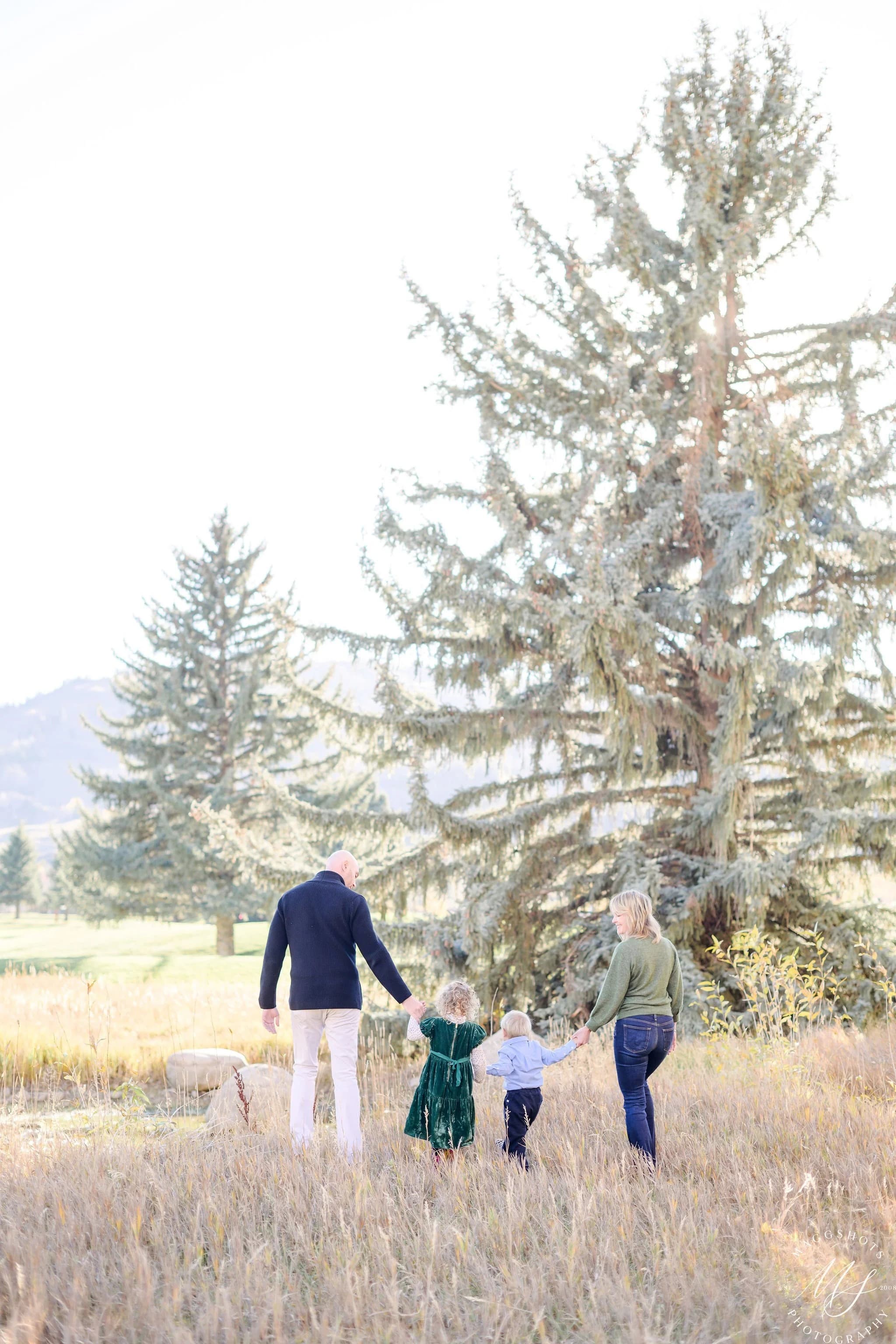 Sally and Zach walking with their children