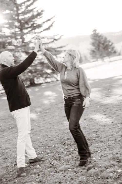Sally and Zach dancing together outdoors